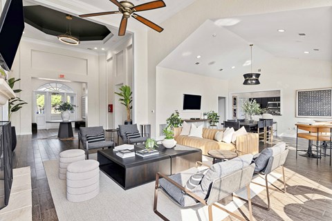 a living room with couches and chairs and a table